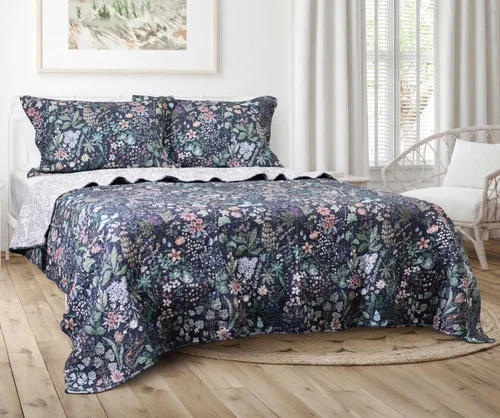 Angled view of our Sydney Cotton Quilt Set dressing a queen bed.