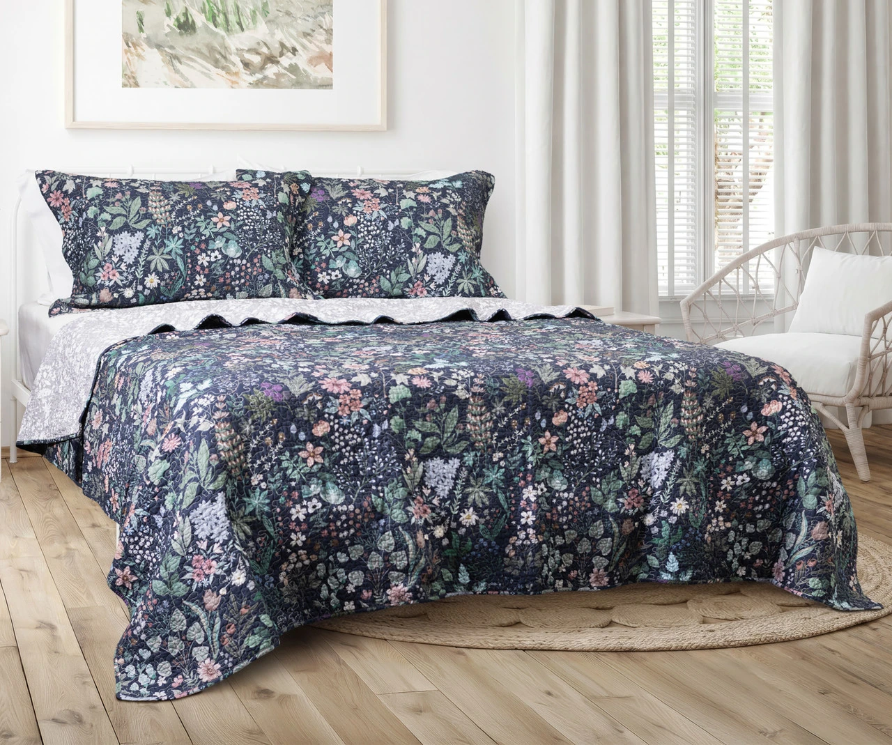 Angled view of our Sydney Cotton Quilt Set dressing a queen bed.