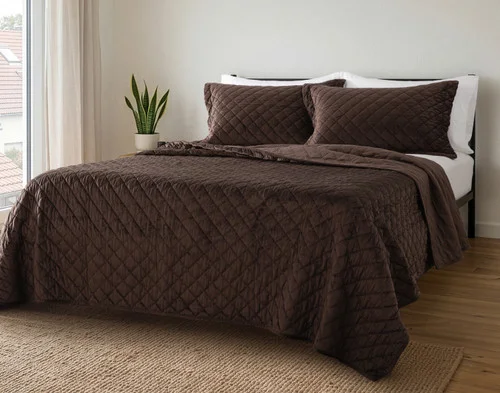 Angled view of our Jasper Quilt Set dressing a queen bed.
