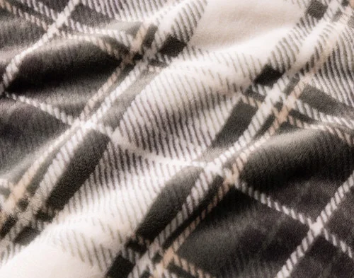 Close-up of the smooth cashmere surface of our Pine Plaid Blanket.