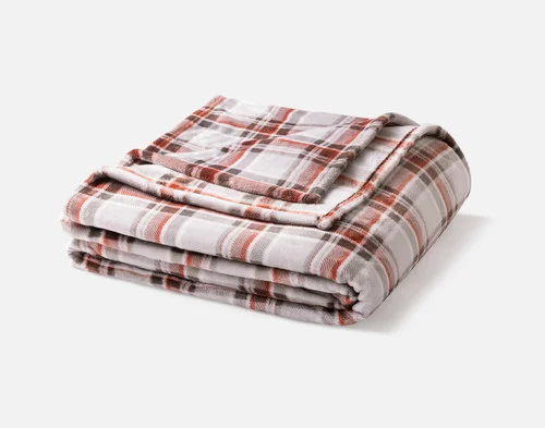 Our Brome Plaid Blanket folded neatly into a square.