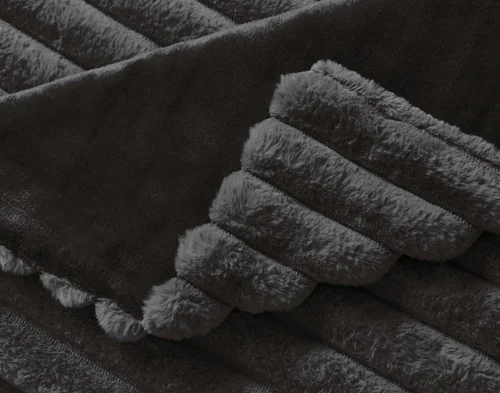 Close up on the folded surface of our Channel Plush Throw - Dark Slate.