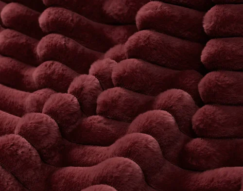 Close up on the surface of our Channel Plush Throw - Mulled Wine.