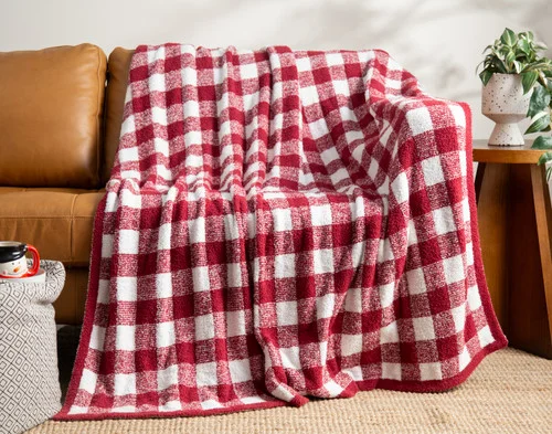 Our Chenille Jacquard Throw - Buffalo Lodge draped over a brown couch.