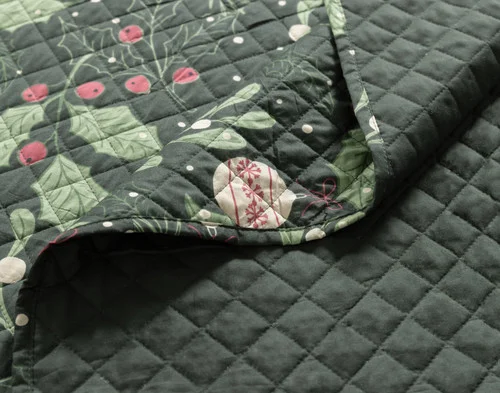 Close-up on a folded corner from our Everwood Coverlet Set.