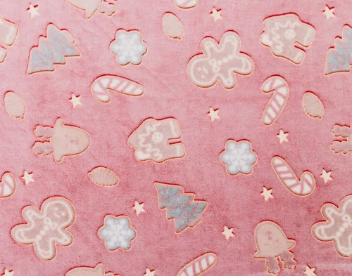 Close-up of a flat surface on our Holiday Huddle Glow in the Dark Throw.