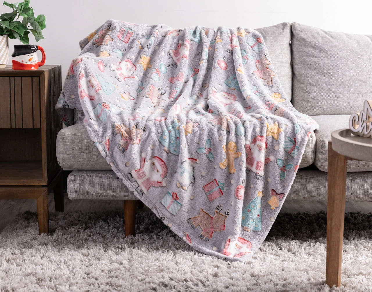 Our Frosted Fun Glow in the Dark Throw draped over a couch.