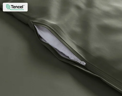 Close view of our Eucalyptus Luxe Duvet Cover in Bonsai Green at its opening.