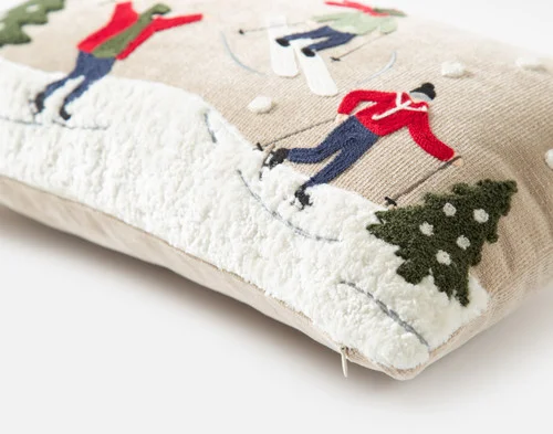 Close up on the corner of our Powder Day Holiday Boudoir Cushion against a white background.
