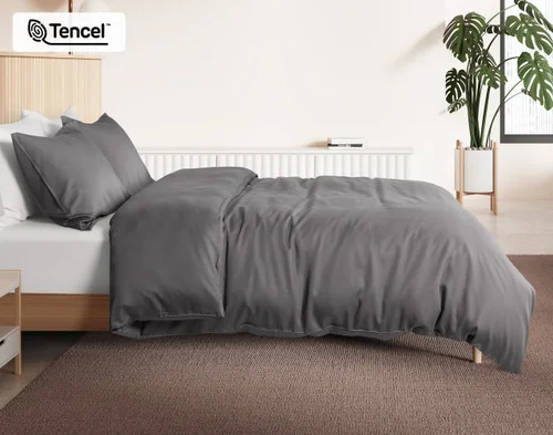 Side view of our Pewter BeechBliss Duvet Cover Set dressed over a plain queen bed.