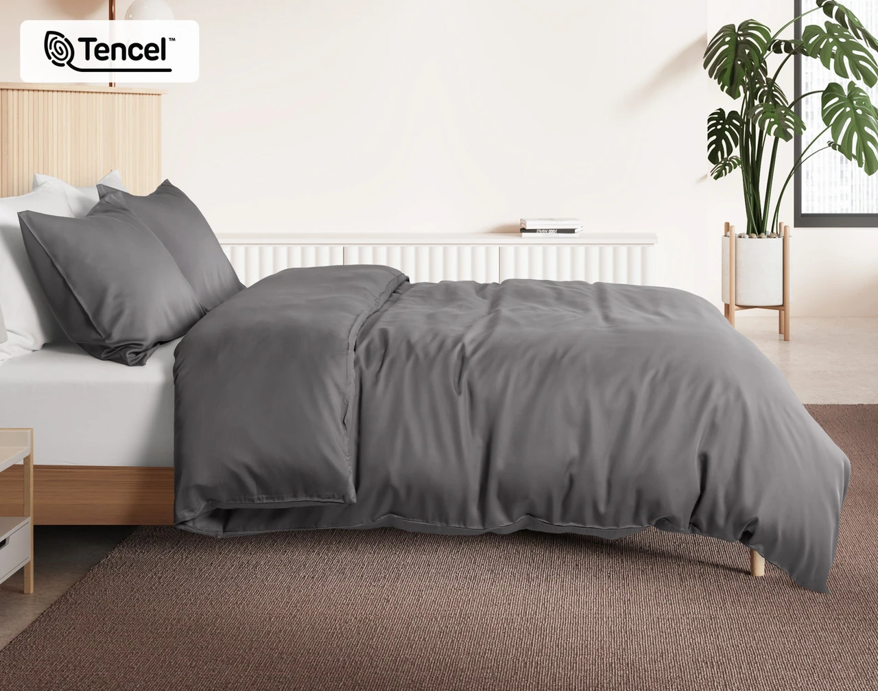 Side view of our Pewter BeechBliss Duvet Cover Set dressed over a plain queen bed.