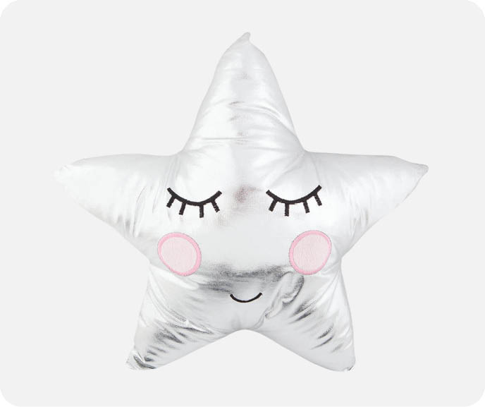 Our silver Shiny Cozy Cuddle Cushion features a star-shaped 3D design and an embroidered sleeping face.