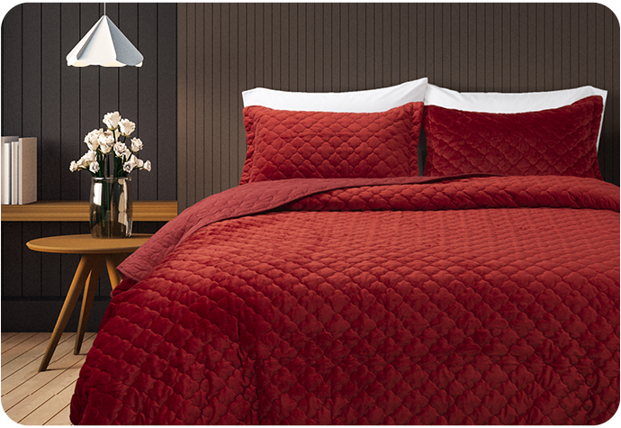 Our Lattice Ruby Quilt Set features a vibrant red quilted design and coordinating pillow shams