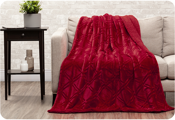 Our Diamond Etched Throw in Ruby features a dimensional red diamond print