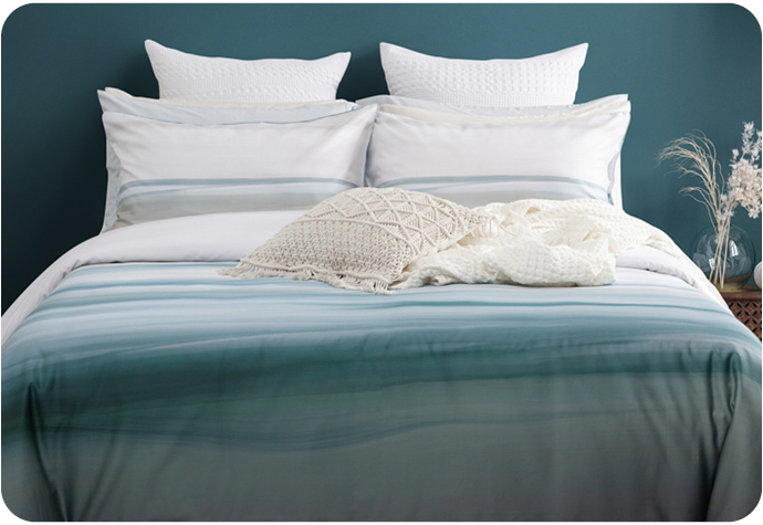 Our Tidal Bedding Collection features a blue duvet cover with a teal gradient and coordinating pillow shams