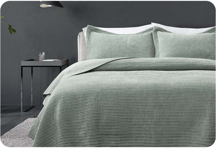 Our Thayer Quilt Set is a pale sage green with a corduroy texture and includes coordinating pillow sham(s).