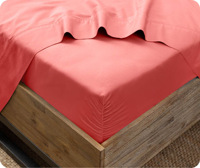Our Bamboo Cotton Fitted Sheet in Hibiscus are a vibrant salmon pink colour and can be bought separately or as a sheet set.