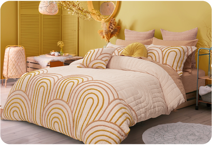 Pale pink bedding set with golden orange detail