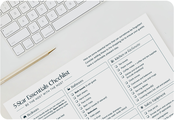 Preview of QE Home Essentials Checklist on white background next to keyboard and pen