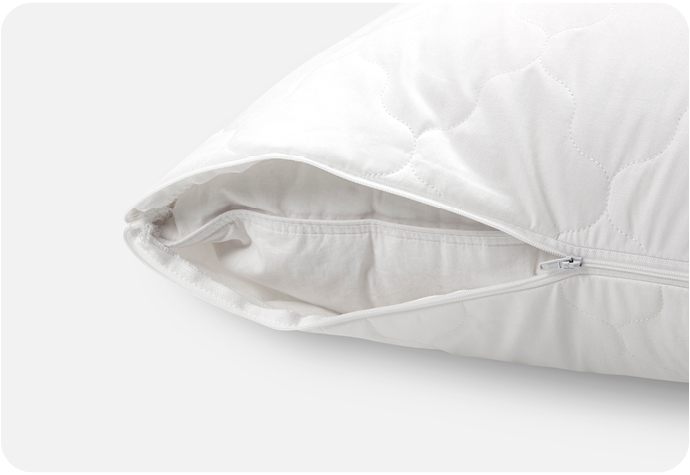 White pillow protector with zip showing white pillow inside on a blank background