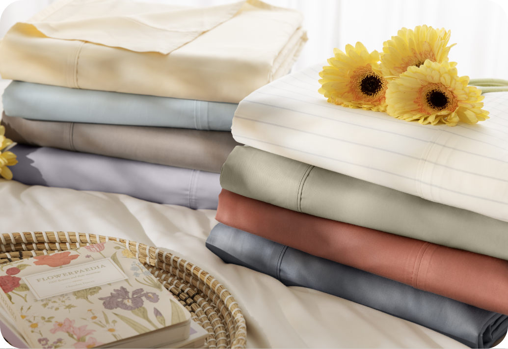 A stack of sheets with sunflowers.