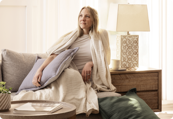 Relaxing with bamboo gauze A women relaxing with bamboo gauze products.