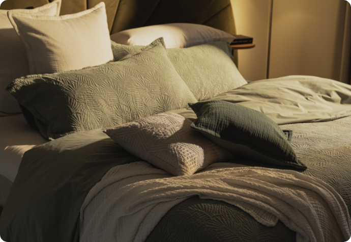 Our Matosa Collection, Portugal Reserve Our Matosa collection dressing a bed with warm lighting.