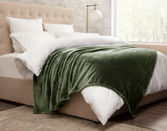Cashmere Touch Blanket in Green on Bed