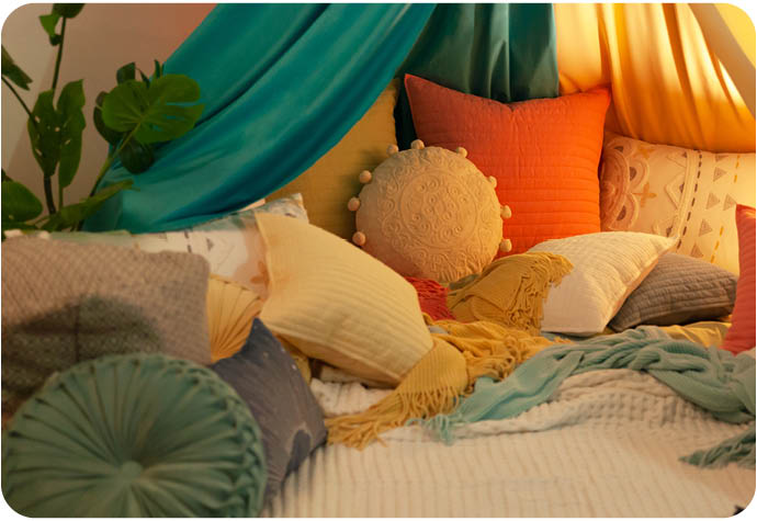Close up of our blanket fort using QE Home home decor and accessories
