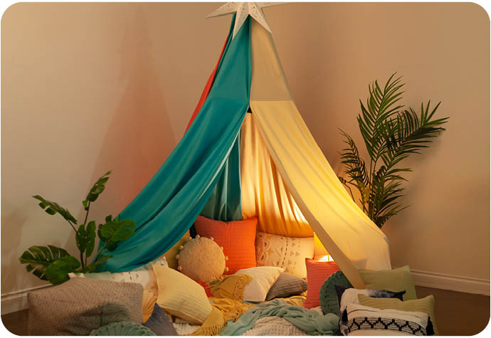 Our blanket fort constructed using our Bamboo Cotton Sheet in Reef and our Undyed & Unbleached Organic Cotton Sateen sheet