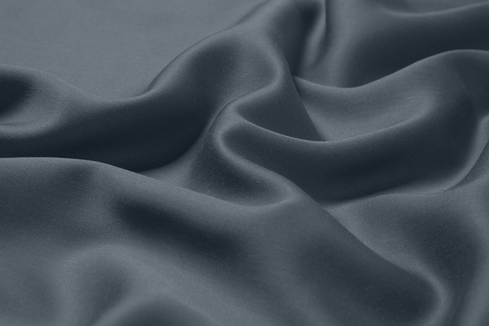 Close up fabric texture of Eucalyptus Luxe TENCEL™ Lyocell blend sheets in Thundercloud sheets