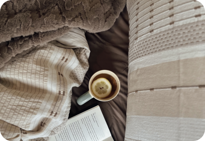 Our Adrift Duvet Cover with a cup of tea.