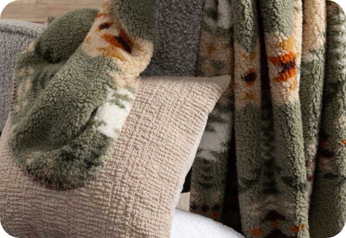 Rustic-looking throws and cushions.