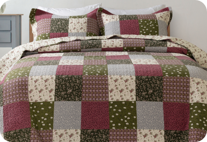Front view of our Bless Cotton Quilt Set on a bed.