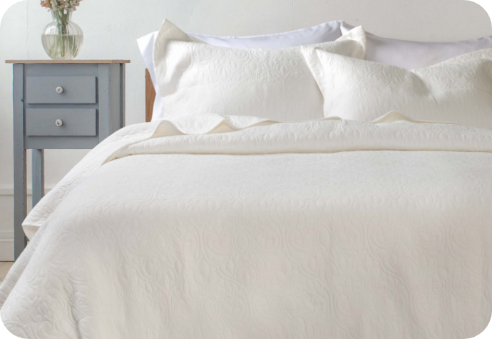 Our Claire Quilt Set dressing a bed.