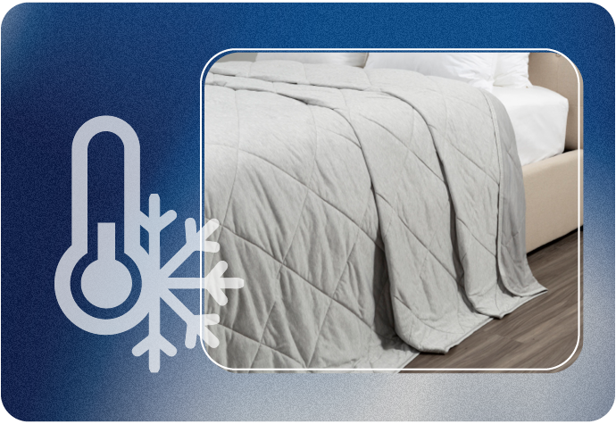 Our Cool Touch Blanket draped over a bed with a blue border, featuring a thermometer and snowflake.