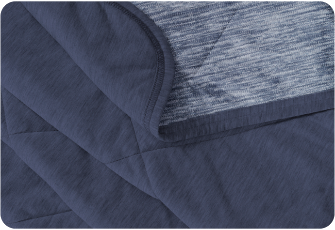 Close-up of our Cool Touch Blanket in Navy Blue to show its soft cooling face and bamboo blend backing.