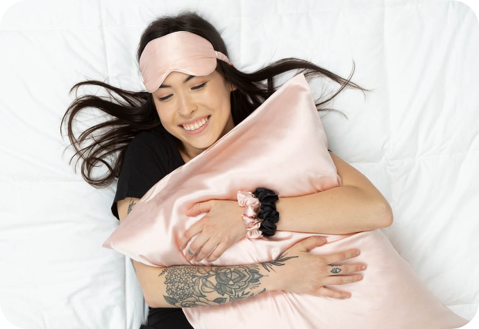 A woman enjoying silk in bed