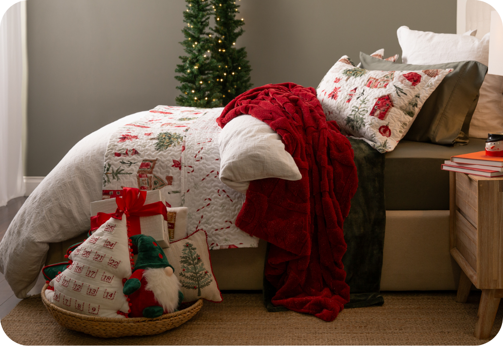 Our Chalkstone Duvet Cover dressing a bed in with holiday decorations.