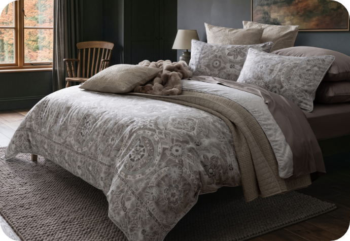 Our Romano Duvet Cover Our Romano Duvet Cover dressing a bed with accessories.