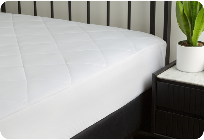 Our Cool Touch Mattress Pad shown fitted on a bed.