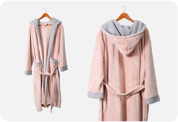 Our Blush Fleece Boucle Bathrobe featuring a hood and grey contrast trim.