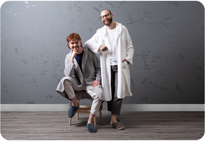 Our Chenille Sherpa Bathrobes in Grey and White shown on two models.