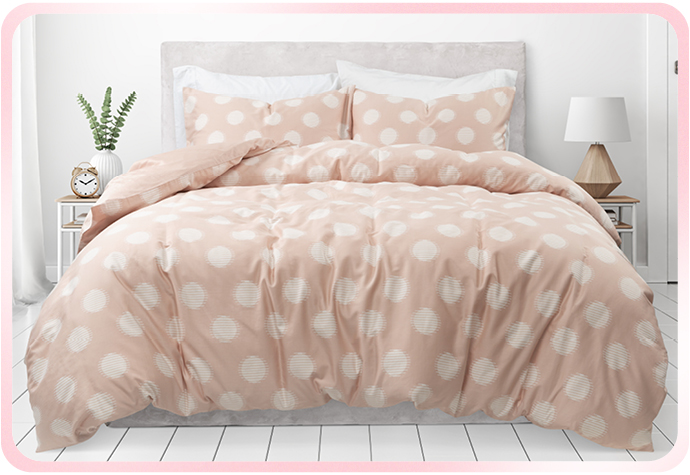 Our pink and white Organic Cotton Duvet Cover Set in Sloane is pictured in a white bedroom. Our pink and white Organic Cotton Duvet Cover Set in Sloane is pictured in a white bedroom.