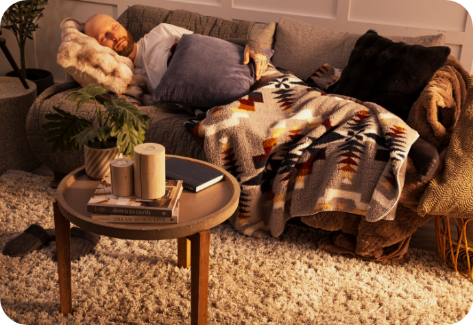 A man lying on the couch enjoying some downtime.