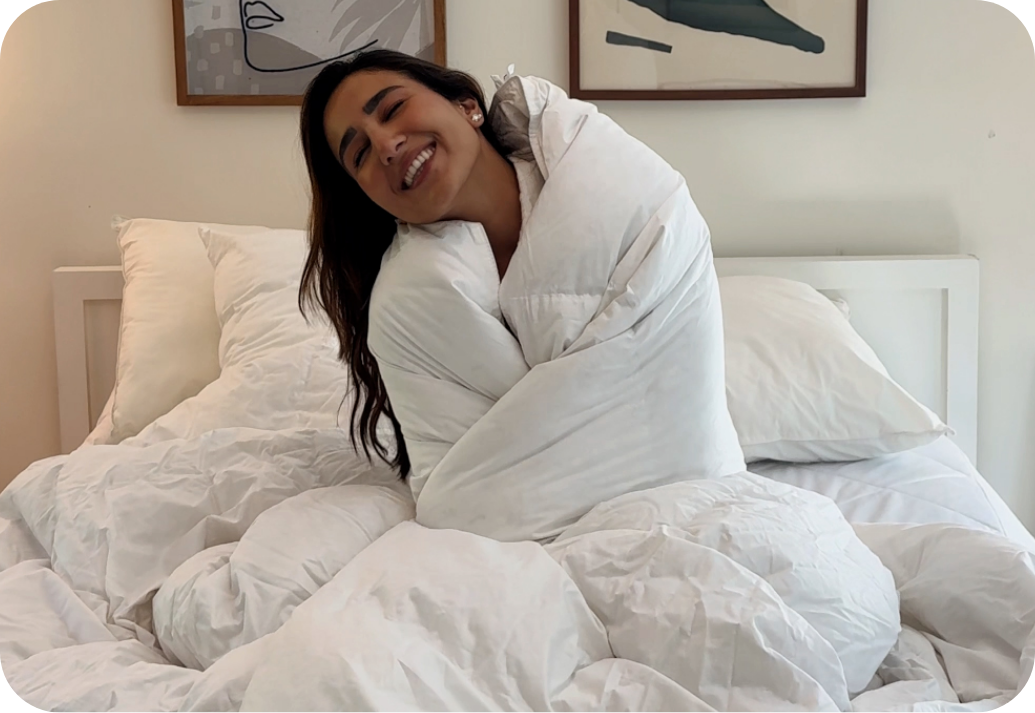 Woman bundled up in a duvet.