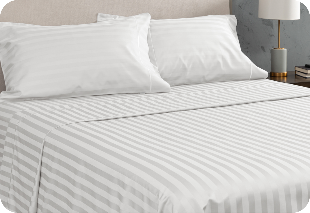 Egyptian Cotton Crispness A queen bed dressed in Egyptian Cotton sheets.