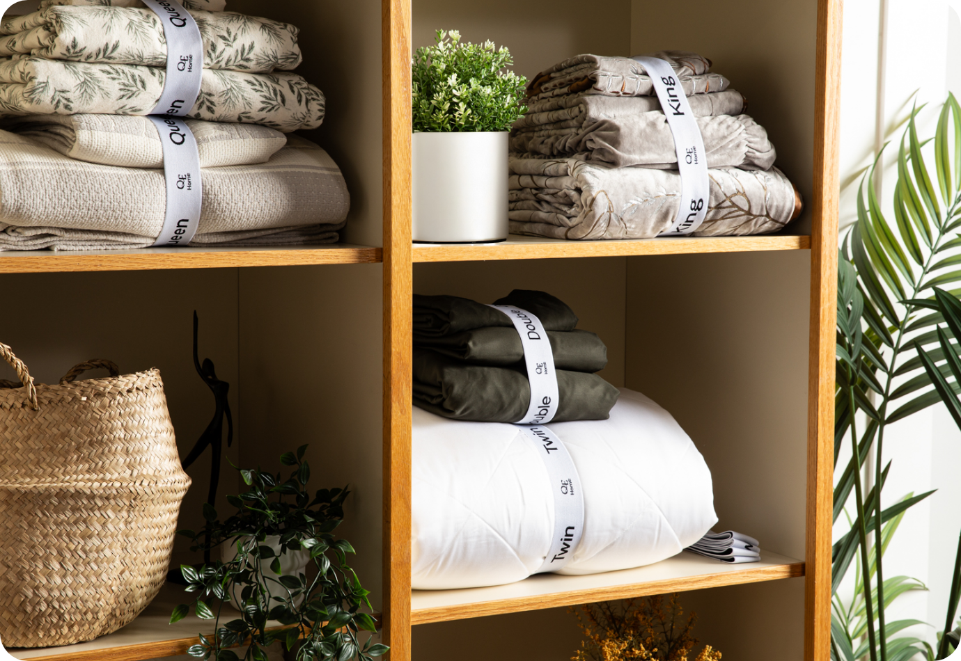 A linen closet organized with our Bedding Bundlers.